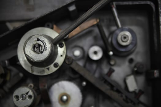 Machine part with the word 'disengage' and an arrow