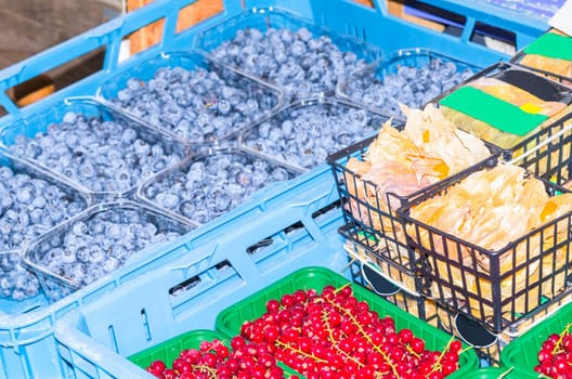 Currants and blueberries at a market..