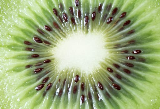 Center of a Sliced Kiwifruit close up macro image.