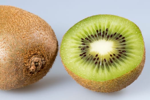 Kiwifruit Close Up. One sliced and one whole one.