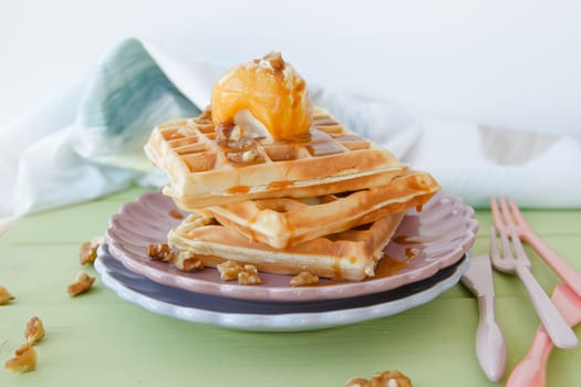 Waffles with vanilla ice cream ,caramel and walnuts