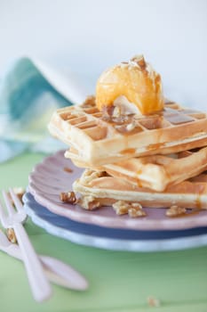 Waffles with vanilla ice cream ,caramel and walnuts