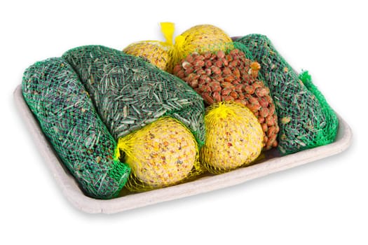 Bird food in cardboard tray exposed on white background