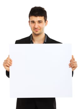Young businessman holding blank board and looking at the camera. Isolated on white background