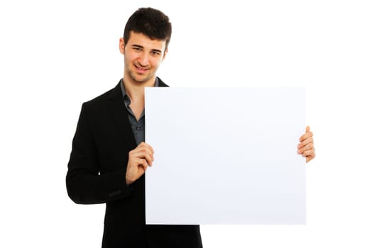 Young businessman holding blank board isolated on white background and smiling