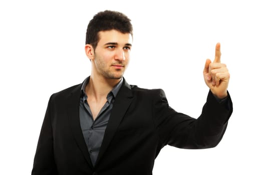 Young businessman pointing with his left hand, isolated on white