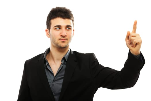 Young businessman pointing with his left hand, isolated on white