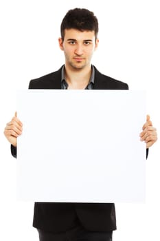 Young businessman holding blank board isolated on white background