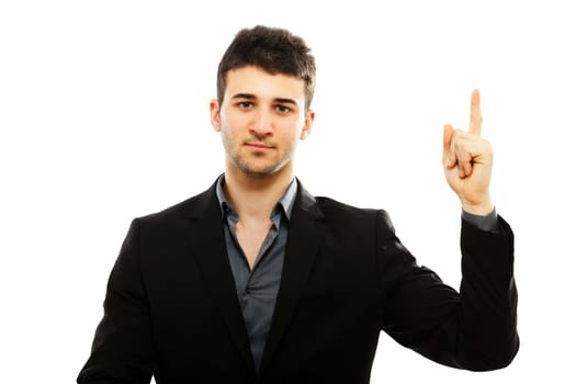 Young businessman pointing up with his left hand and looking at the camera. Isolated on white background