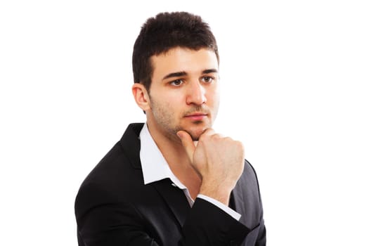 Young businessman looking away. Isolated on white background. Hand on chin.
