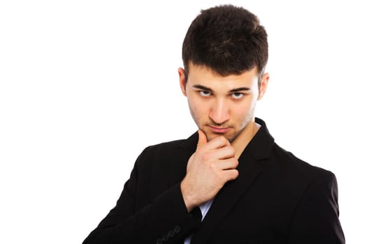 Portrait of a young businessman isolated on white background. Hand on chin.