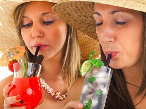 Close up of girls with mojito and tropical drink