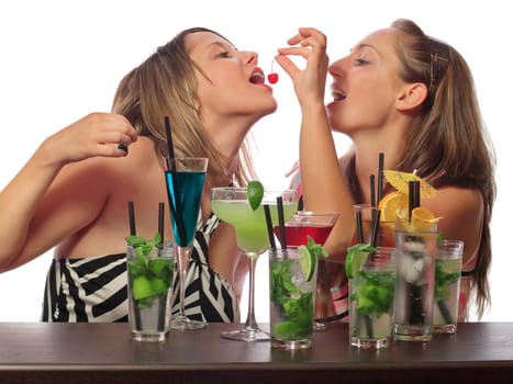 Two girls with a lot of cocktails