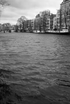 Stream moving along a wide canal in Amsterdam