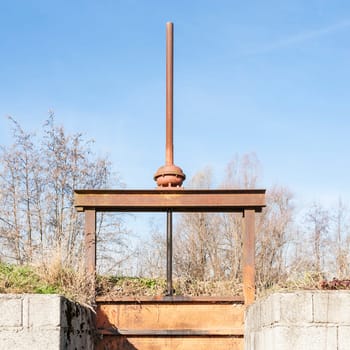 Irrigation Canal and old and manual Flood gate valve