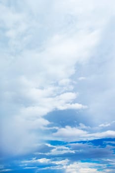 Blue sky background with tiny clouds