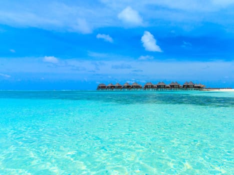 beach with water bungalows at Maldives..