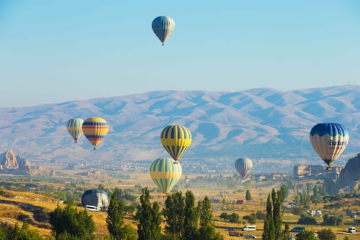 Colorful hot-air balloons flying over the cappadocia