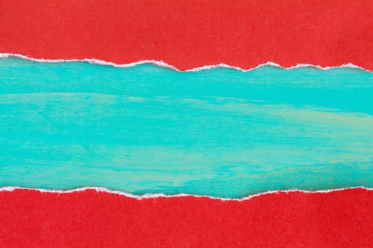 Torn red paper with a blue wooden background for your text