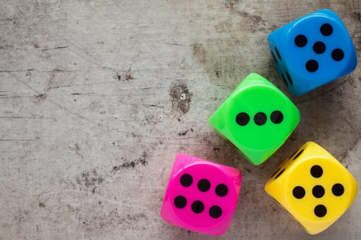 Dices on canvas background with copy-space. Top view.