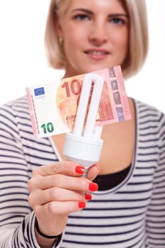 Woman with light bulb energy saving lamp and 10 euro appear environmentally friendly insulated against white background