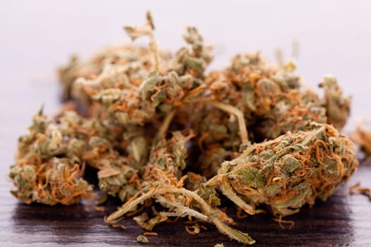 Cannabis marijuana flowers in small bag of drugs close-up
