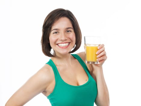 Portrait of a happy brunette drinking an orange juice, isolated on white