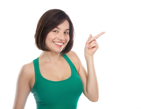 Joyful woman showing something with her finger, isolated on white