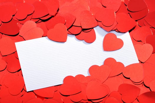 Red glitter hearts with white congratulations card