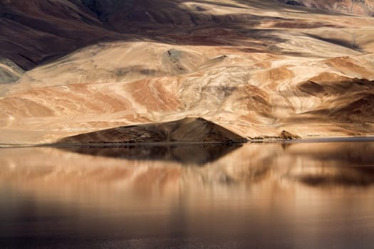 Tsomoriri mountain lake with fantastic mountains background and reflections in the lake (north India)