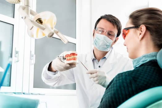 young dentist advising with a bite