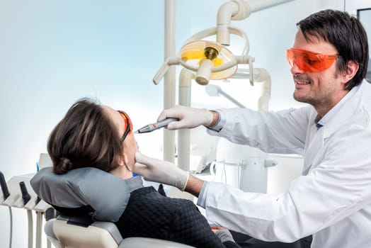 dentist at bleaching for more beautiful teeth