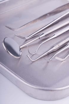 Dentist tools on metal tray
