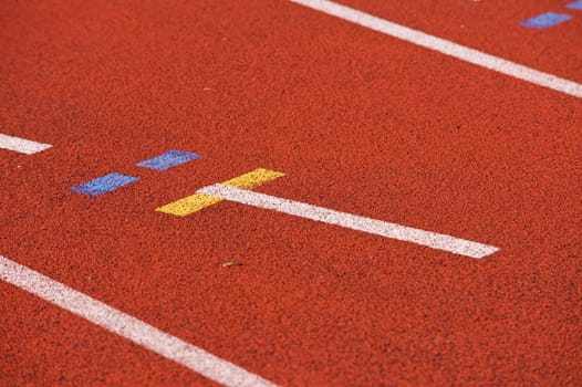 Finish line and numbers on red running track