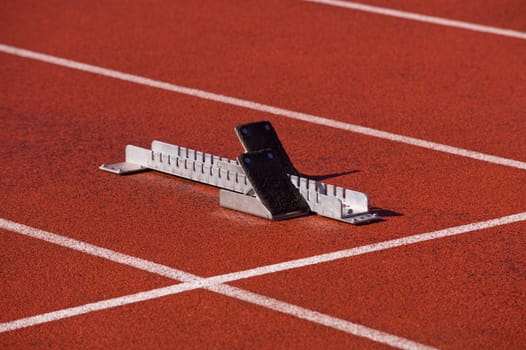 Finish line and numbers on red running track