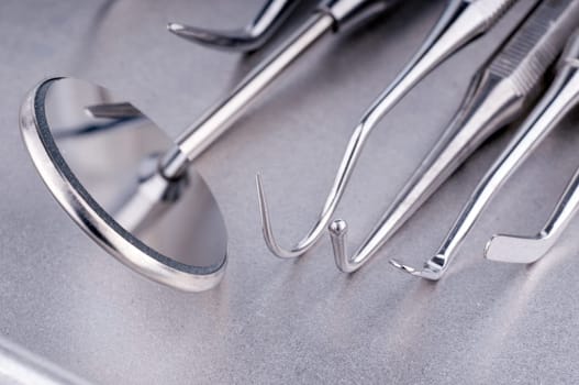 Dentist tools on metal tray