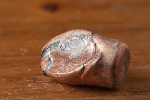 Ricochet full metal jacket bullet on wood