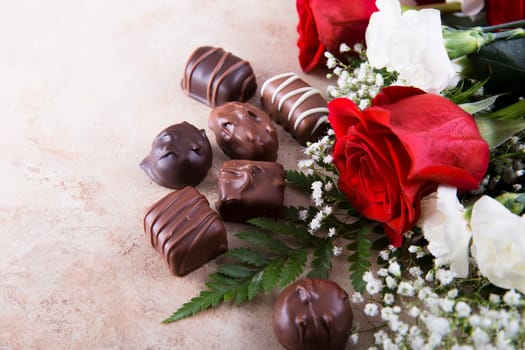 Red roses and chocolate candy for your sweetheart.