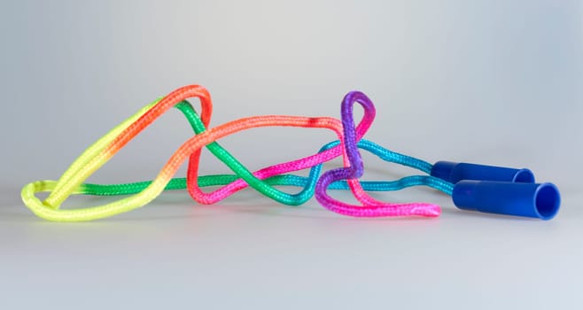 Colorful Skipping Rope on grey background.