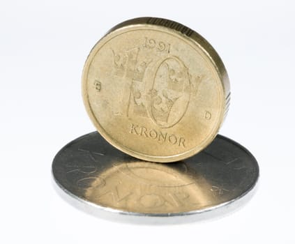 Swedish 10 Krona Standing on 5 krona coin.