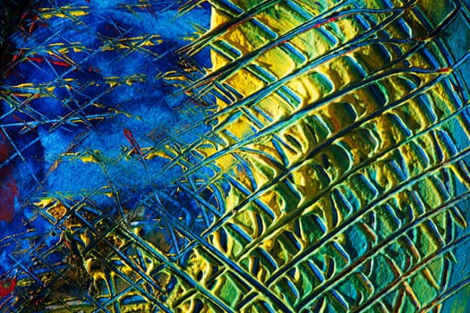 format-filling view of a surface dotted with colorful pasty colors and checkered scratch marks