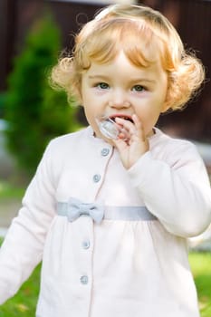 Image of cute baby girl suckle nipple