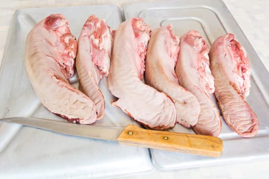 Photo of raw pork tongue in the market place