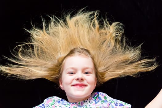 Cute beautiful girl makes faces imitate witch