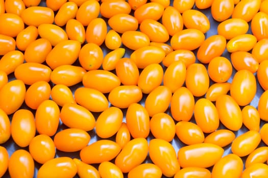 Photo of background with fresh yellow tomatos
