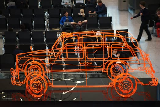 London,United Kingdom - December 20,2015: The transit area of London's Heathrow Airport with the sculpture The London Taxi by Benedict Radcliffe on December 20,2015 in London.
