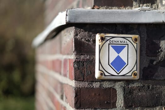 Monument protection signs on an old building in Magdeburg