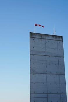 Wind vane on a concrete pillar