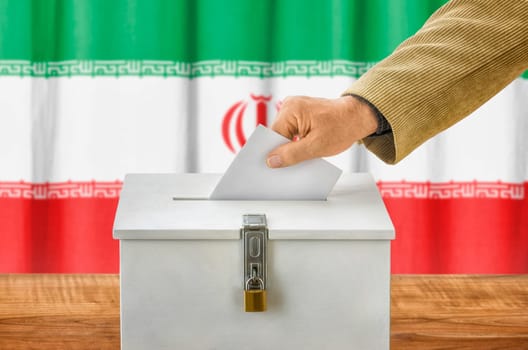 Man throws ballot papers into ballot box - Iran