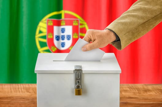 Man throws ballot papers into ballot box - Portugal